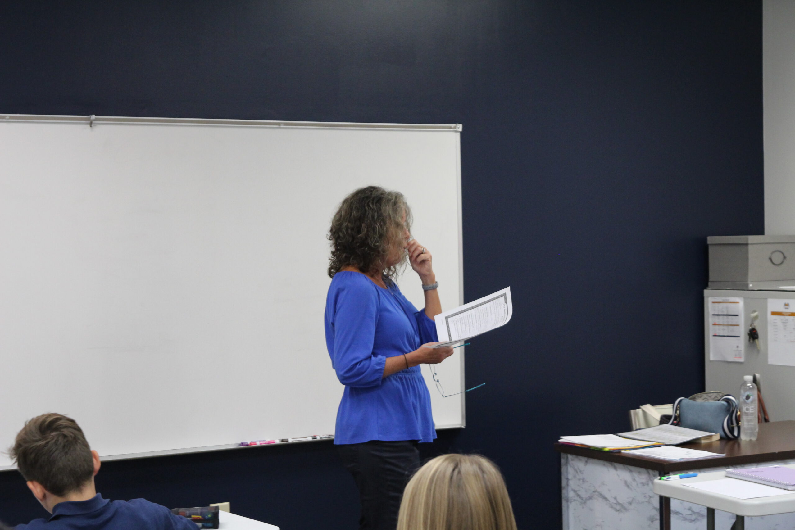 Teacher instructing classroom discussion at Coram Deo Classical Christian School.