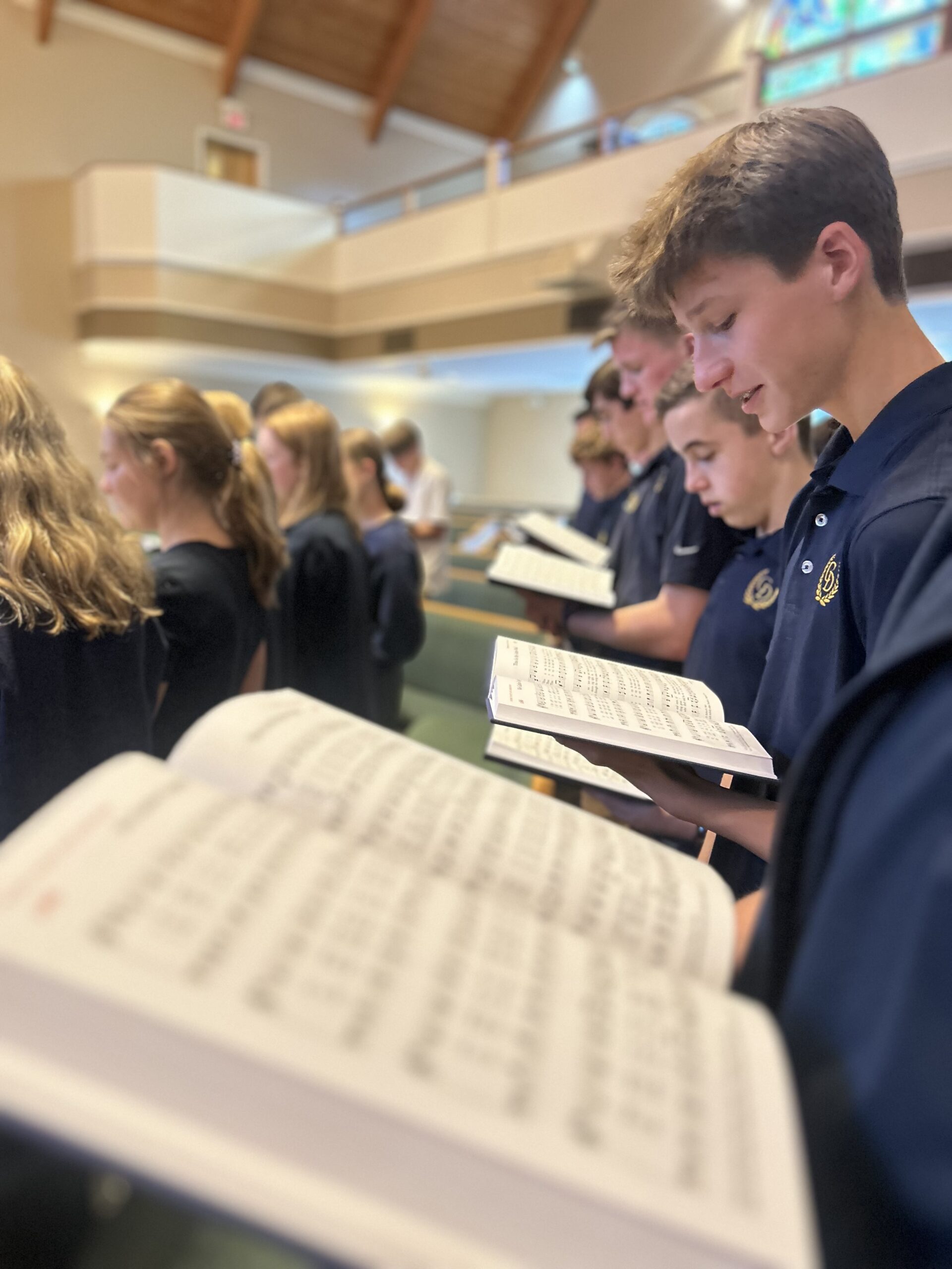 Students at Coram Deo Classical School engaging in Christian Chapel.