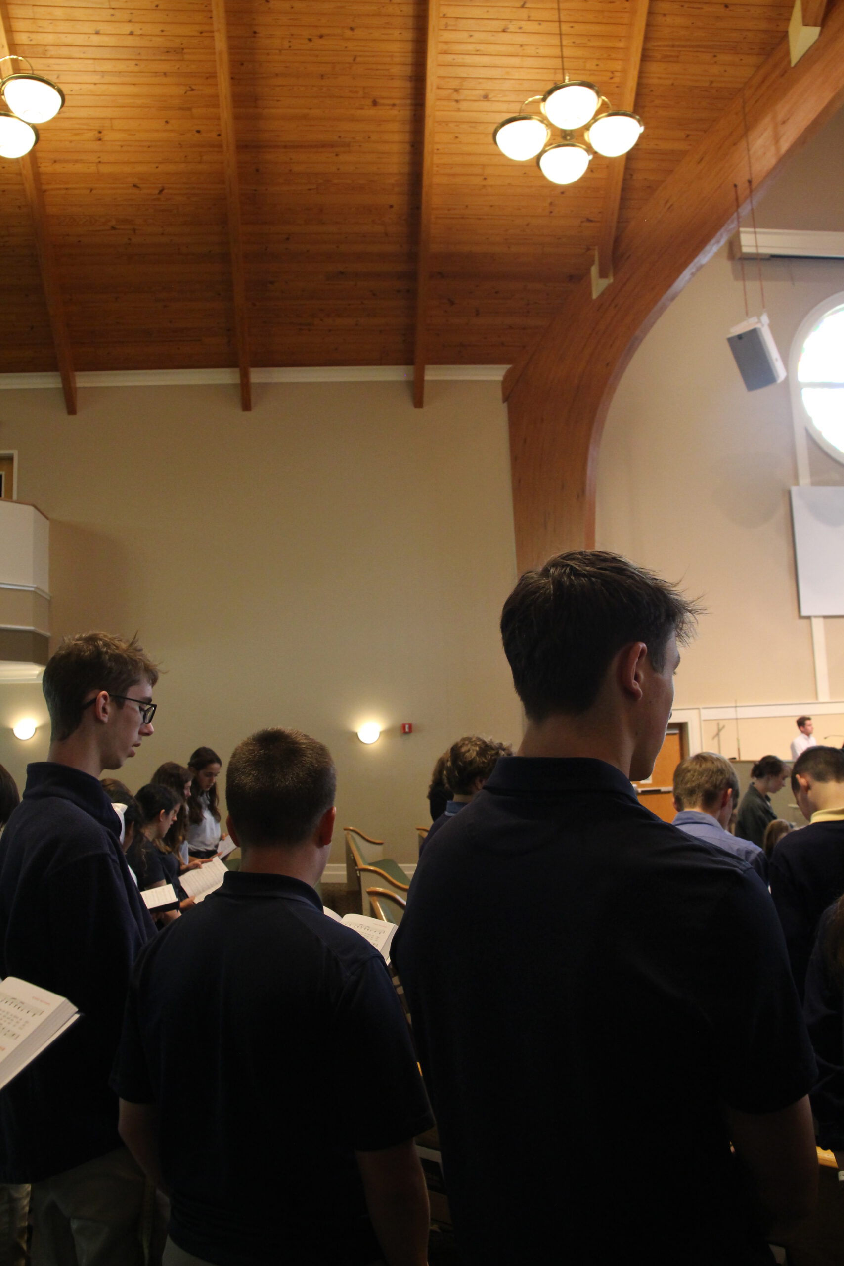 Students participating in Christian chapel at Coram Deo Classical School.